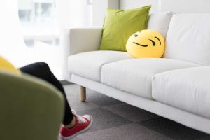 Colorful and Funny Pillows on Sofa in Modern Startup Office